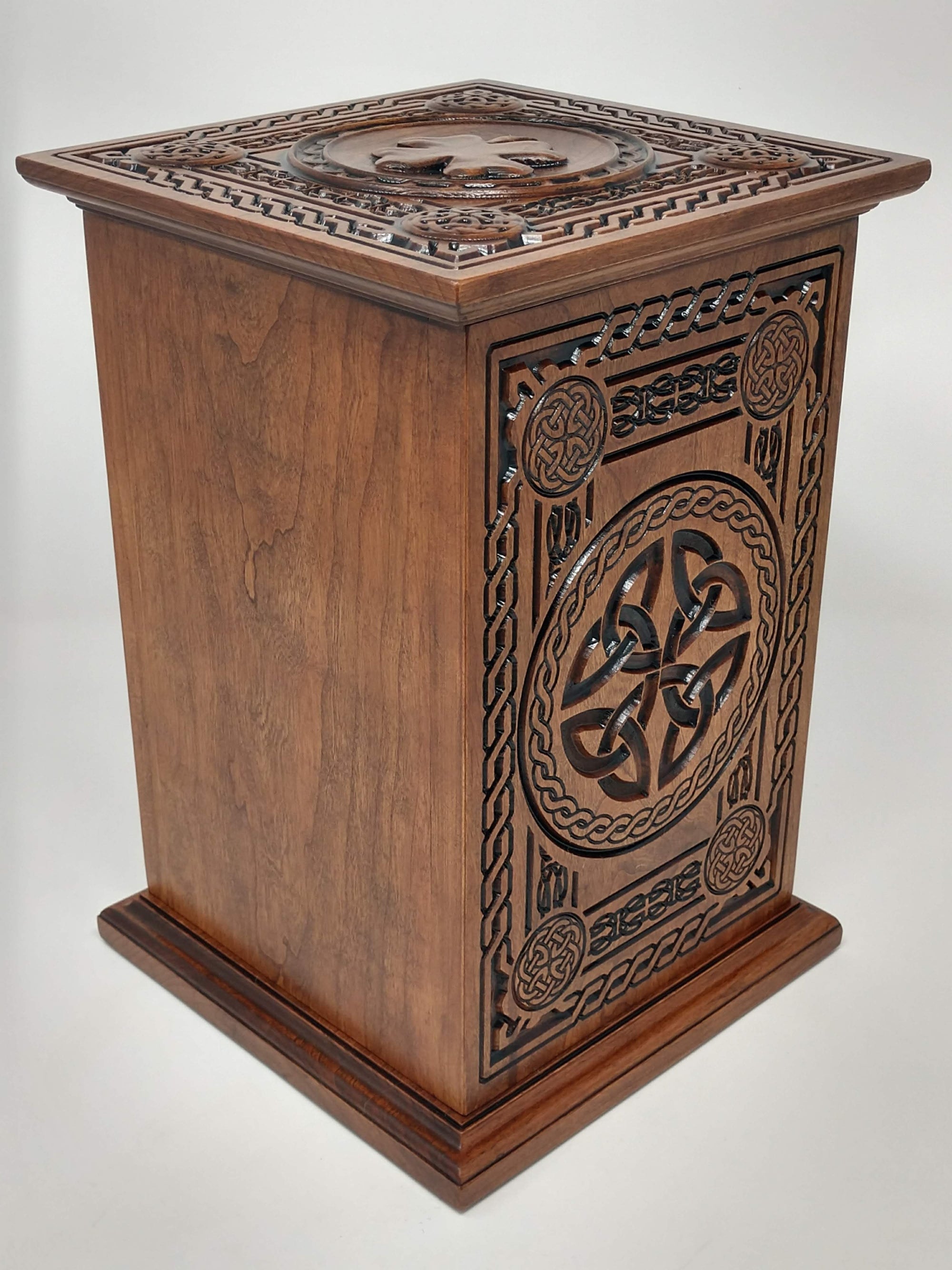 Crematorium urn for human ashes Celtic Tree of Life Urn from the back and side (with trinity knot), and top with shamrock in view. The back is left blank to show where the inscription would be available.