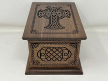 Load image into Gallery viewer, Celtic Cross and Weave Urn viewed from the short side with the top in view as well. The cross is seen on the top and the short side has the celtic weave carving, both surrounded by the celtic weave boarder.
