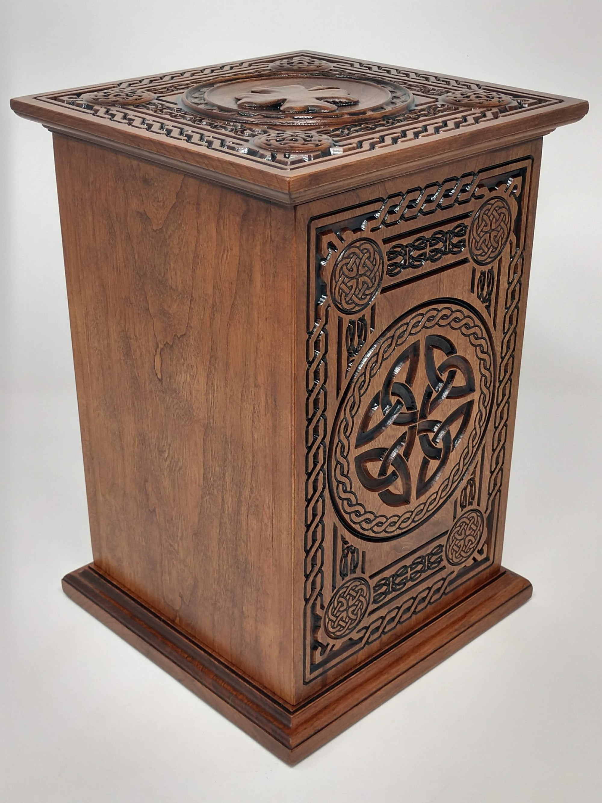 Crematorium urn for human ashes Celtic Tree of Life Urn from the back and side (with trinity knot), and top with shamrock in view. The back is left blank to show where the inscription would be available.