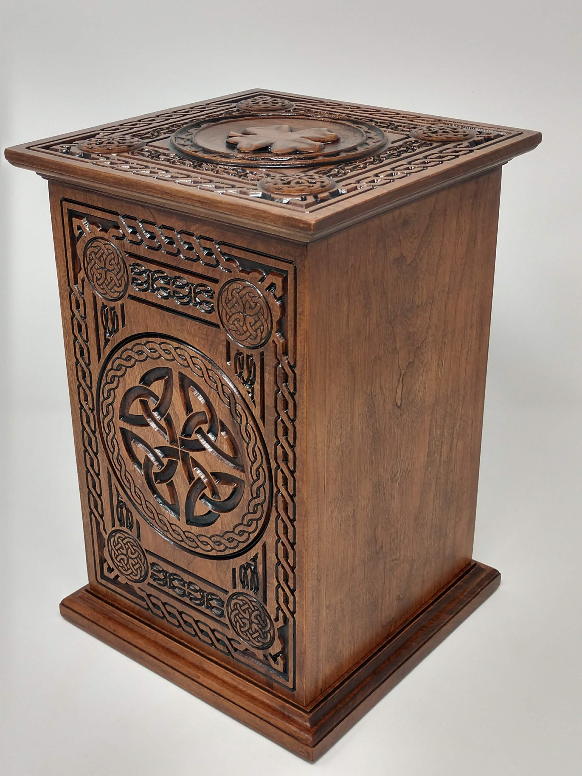 Crematorium urn for human ashes Celtic Tree of Life Urn from the back and side (with trinity knot), and top with shamrock in view. The back is left blank to show where the inscription would be available.